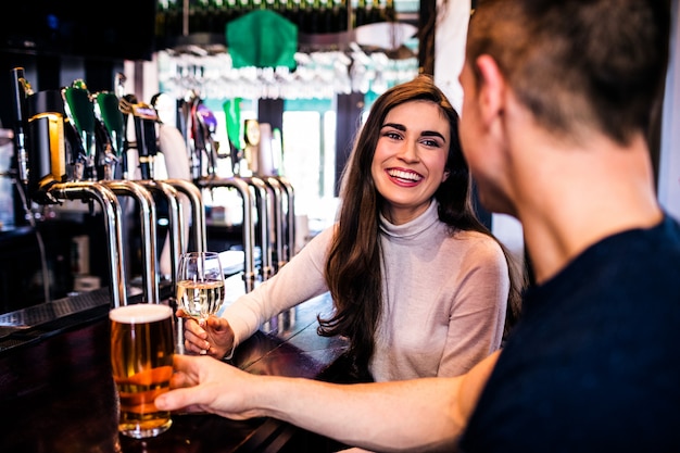 Cute couple having a drink in a bar