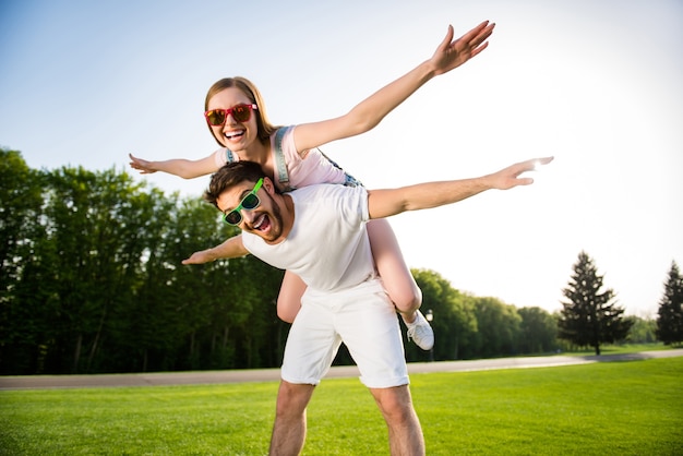 Cute couple posing together outdoors