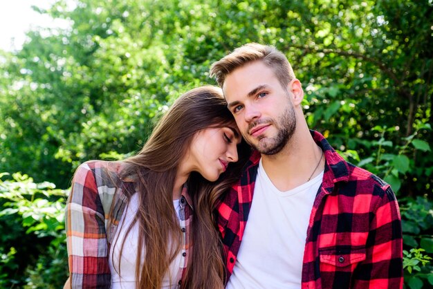 Cute couple valentines day summer camping in forest family weekend romantic date hipster couple outdoor couple in love Hiking man and woman in checkered shirt relax in park