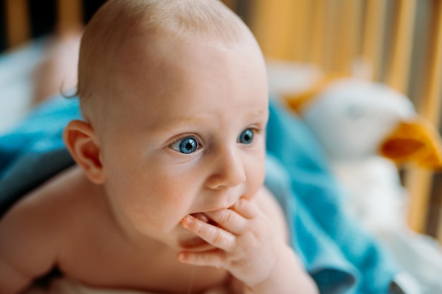 Cute crawling baby with blue eyes