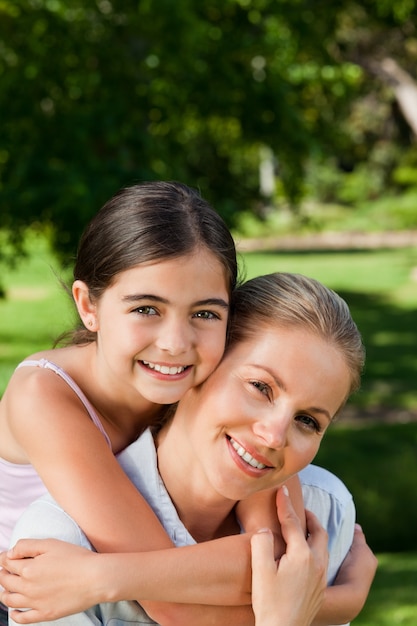 Cute daughter with her mother in the park