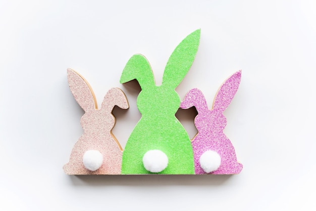 Cute Easter colorful bunnies on a white background Happy Easter minimal concept greeting card soft selective focus