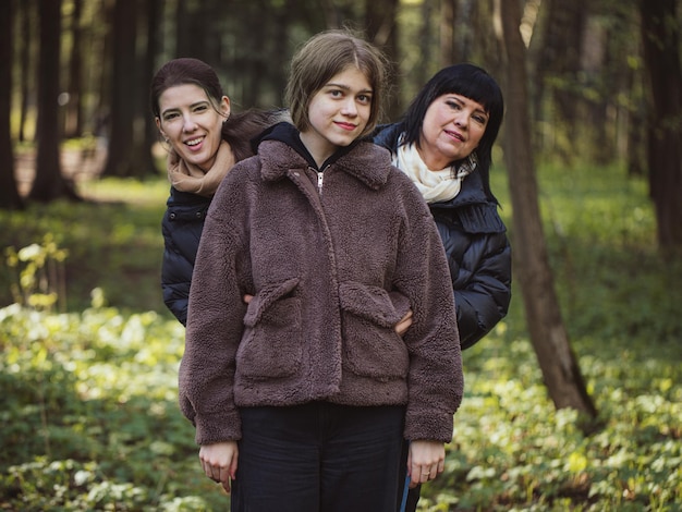 Cute family candid portrait of Mother with daughters