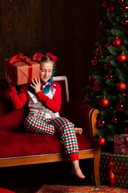 Cute girl before the new year in pajamas