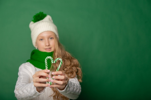 Cute girl is preparing for the new year in the background with gifts