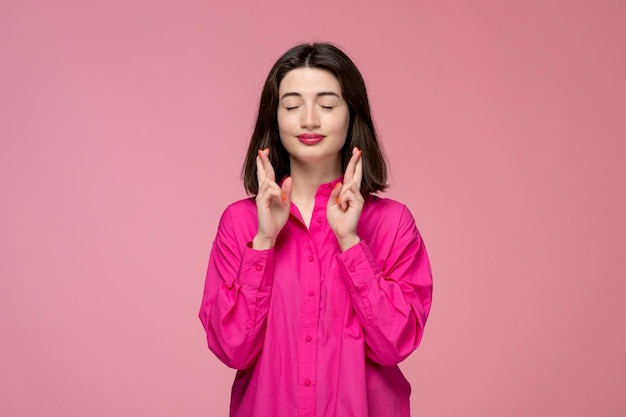 Cute girl lovely adorable lady with red lipstick in pink shirt hoping for something