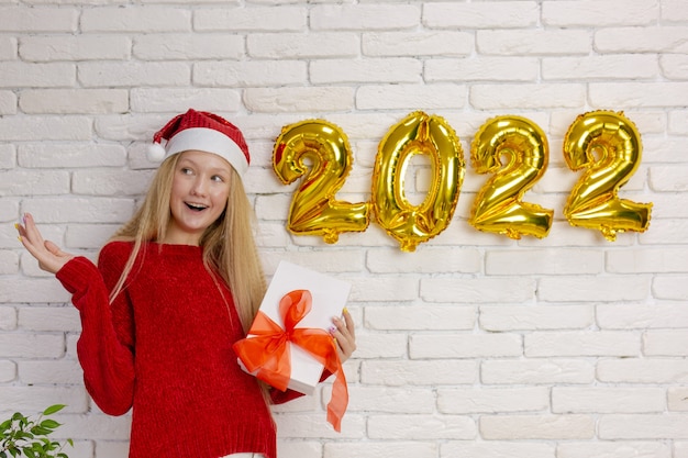 Cute girl preparing for the new year 2022