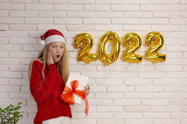 Cute girl preparing for the new year 2022