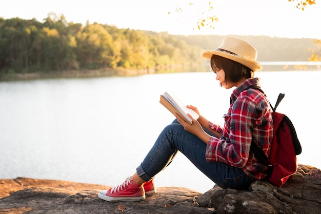 Cute girl reading a book .