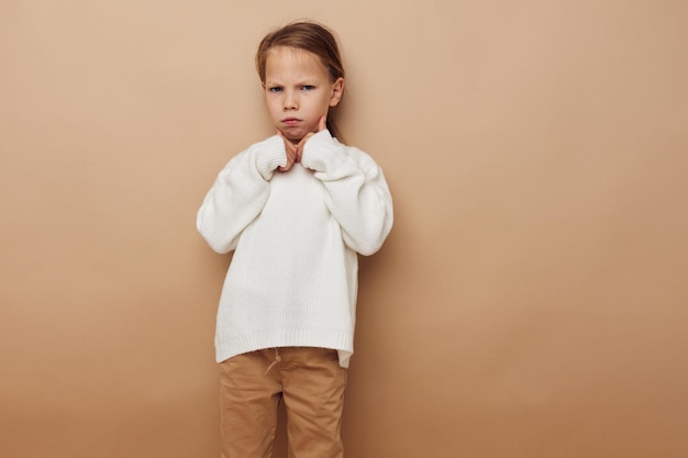 Cute girl in white sweater posing hand gestures Lifestyle unaltered