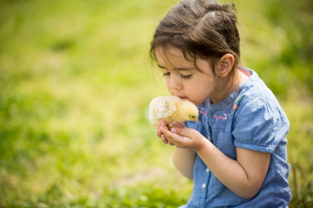 Cute girl with chicken