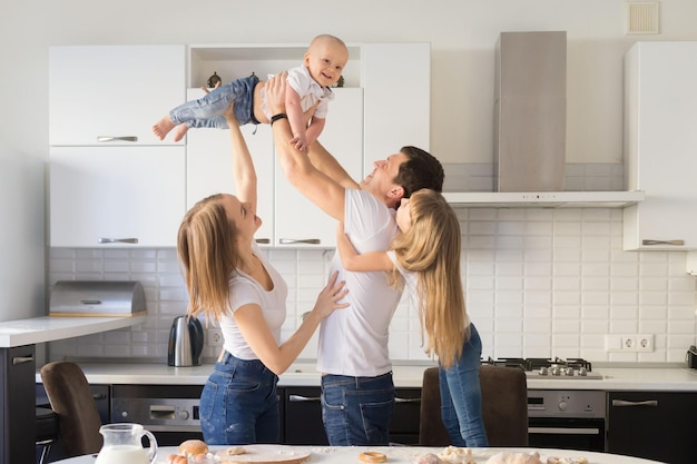 Cute Happy family with their sons at home having fun