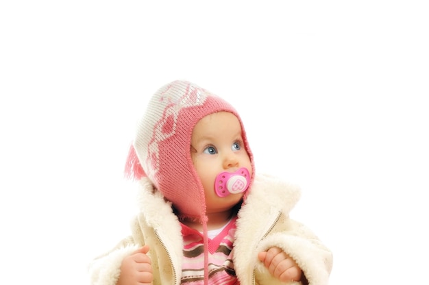 cute happy little baby with winter hat and coat isolated on white