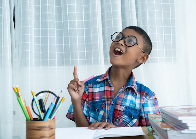 Cute happy little boy getting an idea