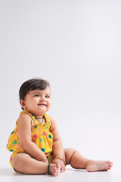 Cute indian baby girl smiling and giving expression