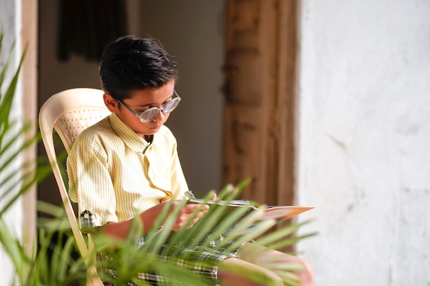 Cute indian child studying at home