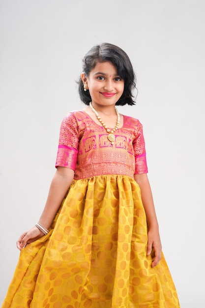 Cute indian little girl giving expression on white background