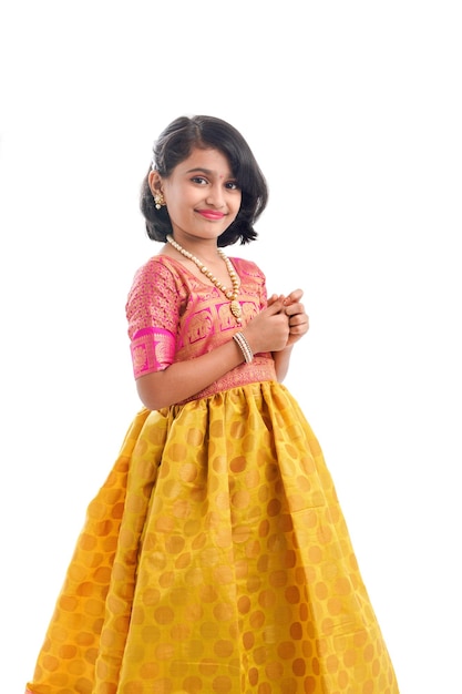 Cute indian little girl giving expression on white background