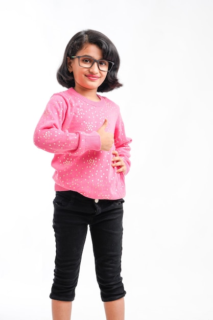 Cute indian little girl giving expression on white background