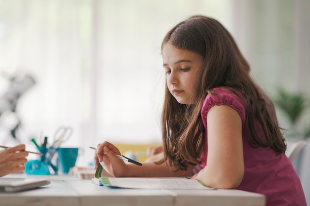 Cute kid studying at home