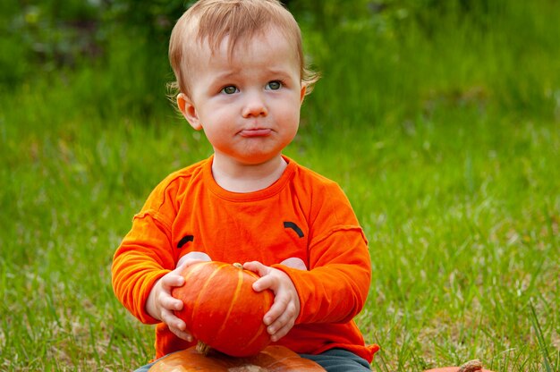 Cute little baby boy in a pumpkin costume