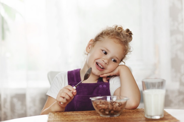 Cute little baby girl having Breakfast