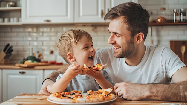 a cute little boy and his father sharing a joyful pizza meal in the kitchen bathed in natural light their faces beaming with happiness and smiles