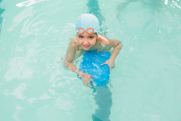 Cute little boy learning to swim 