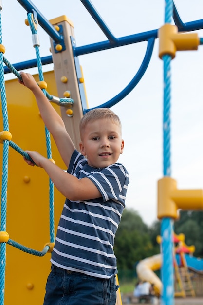 Cute little boy playing in the playground