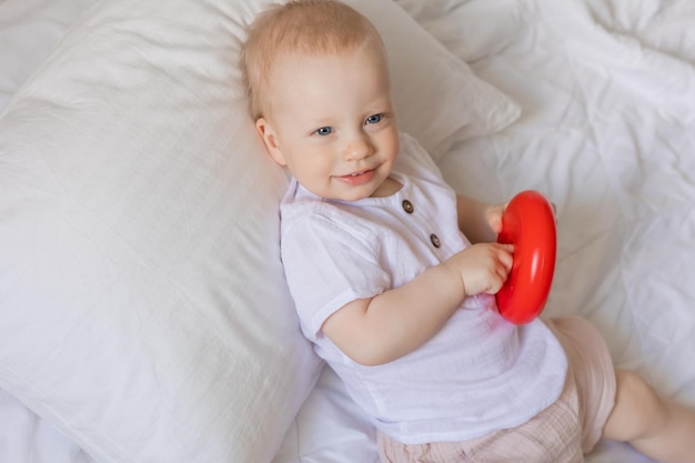 cute little boy playing with toys on blanket, health, banner, card, space for text