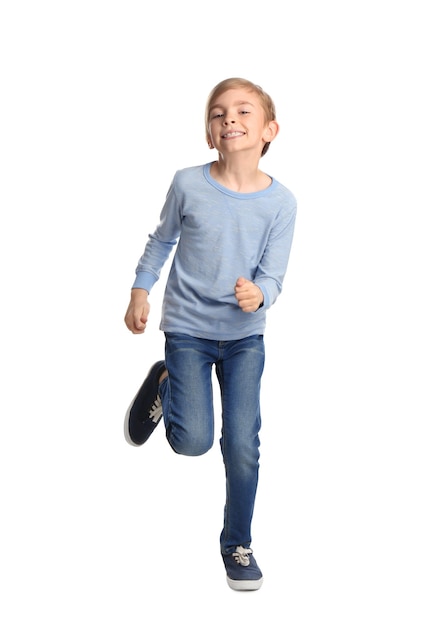 Cute little boy running on white background