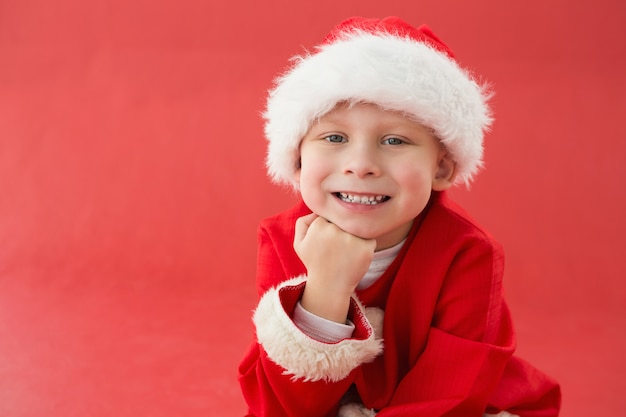 Cute little boy in santa costume