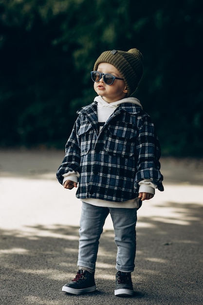 Cute little boy walking in an autumn park