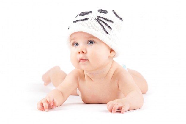 cute little boy in white diaper and cat hat