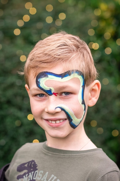 Cute little boy with his face painted