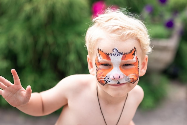 Cute little boy with his face painted