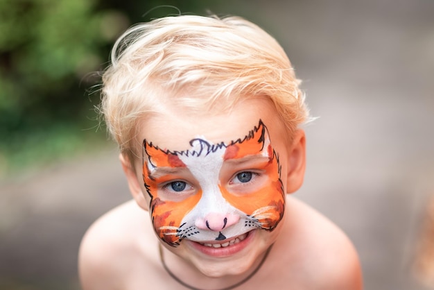 Cute little boy with his face painted