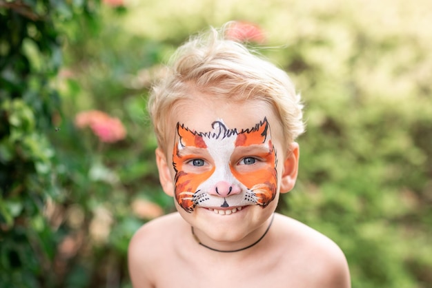 Cute little boy with his face painted