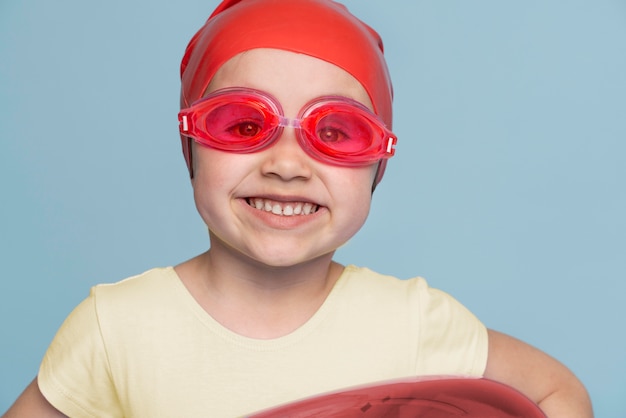 Cute little girl being ready for summer with a swimming ring