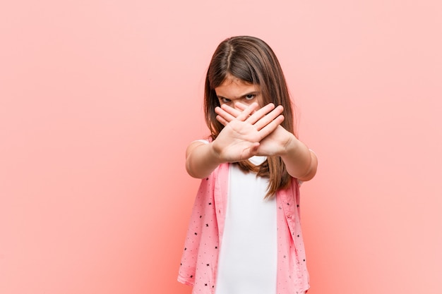 Cute little girl doingdenial gesture