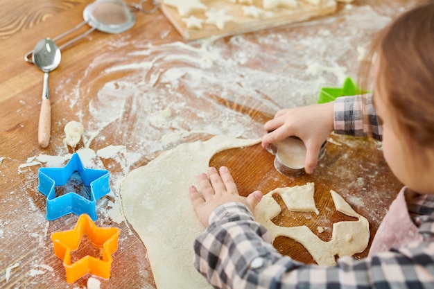 Cute Little Girl Making Cookies