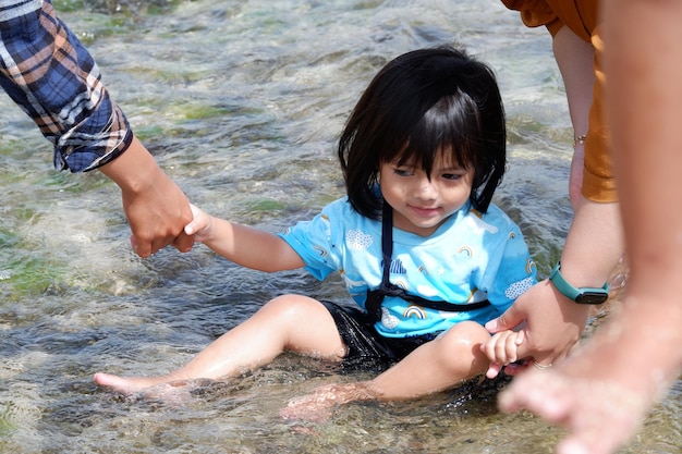 A cute little girl playing on the beach