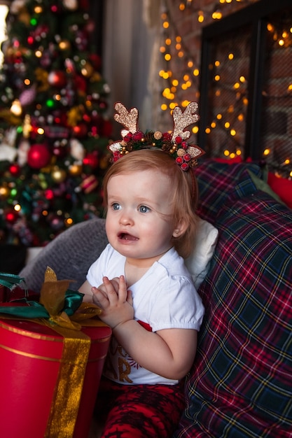 Cute little girl with christmas presents