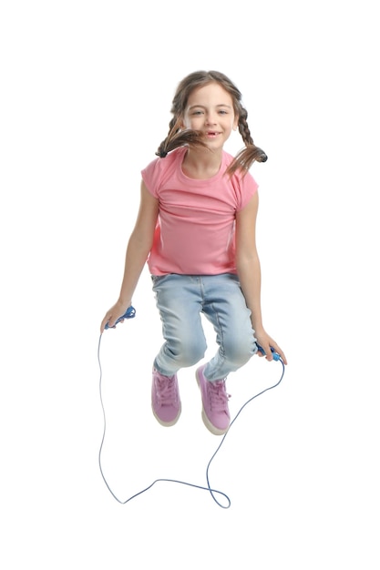 Cute little girl with jump rope on white background