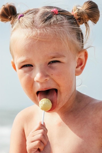 Cute little girl with lollipop