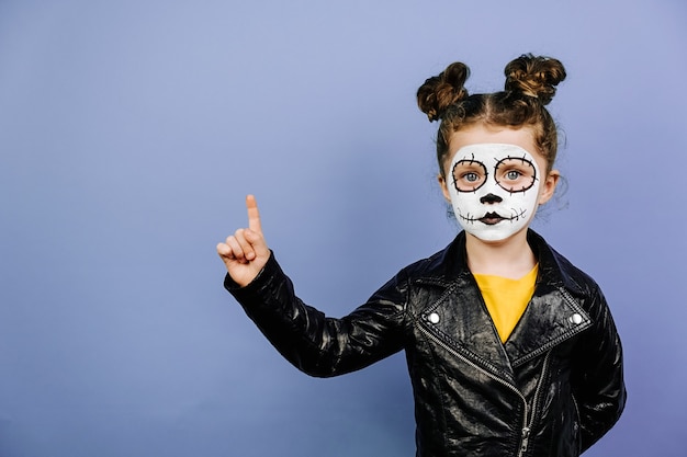 Cute little girl with scary make up for Halloween