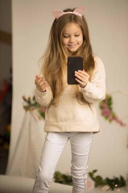 Cute lovely beautiful girl speaking in front of camera for vlog.