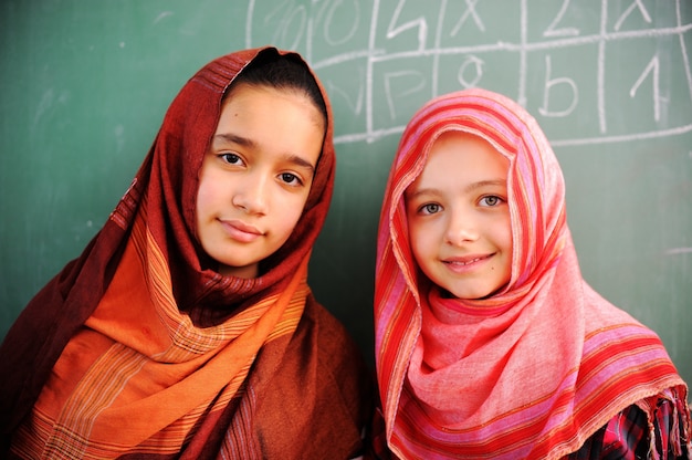 Cute lovely school children at classroom having education activities