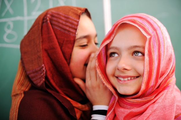 Cute lovely school children at classroom having education activities