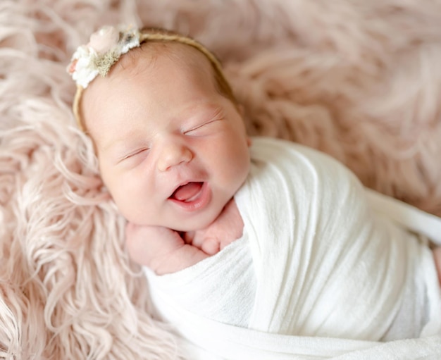 Cute newborn baby girl studio portrait